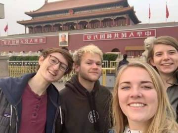 Charles Synder (center) in China